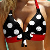 a woman in a polka dot bikini top